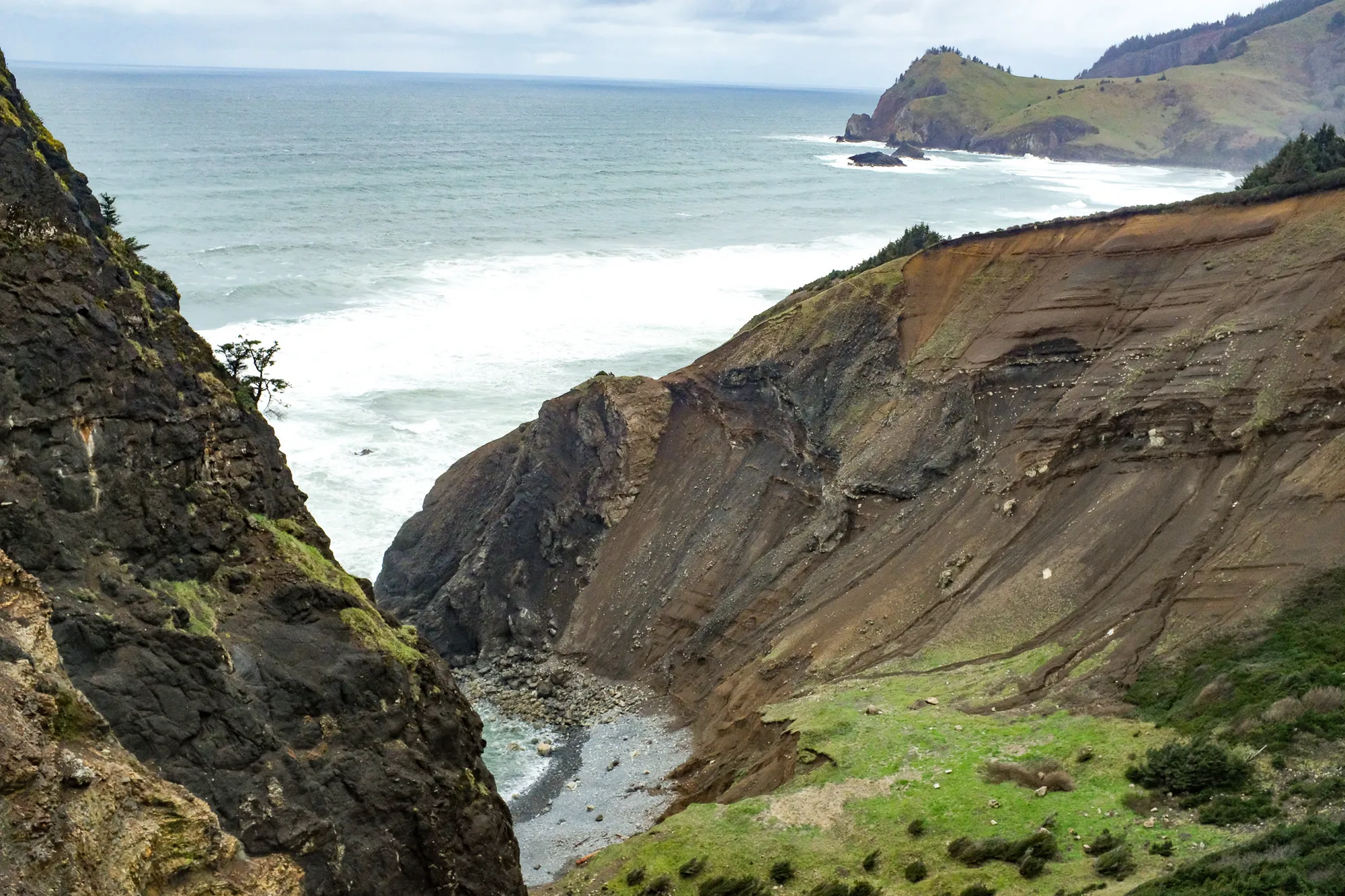 A coastal cliff at the edge of the sea